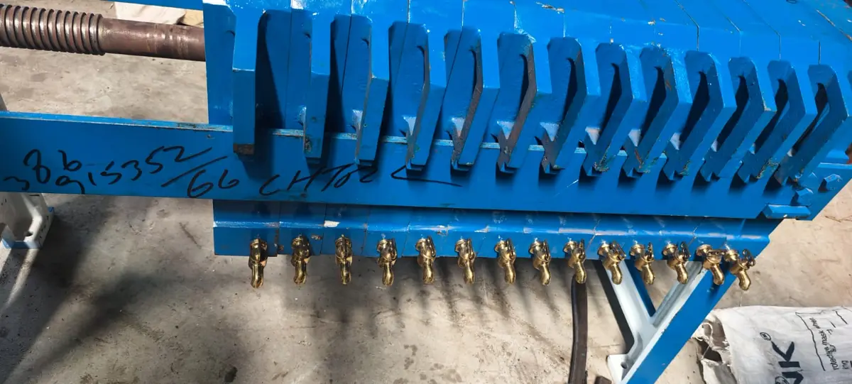 Blue cast-iron casting oil filter press with plate stack and brass drain cocks